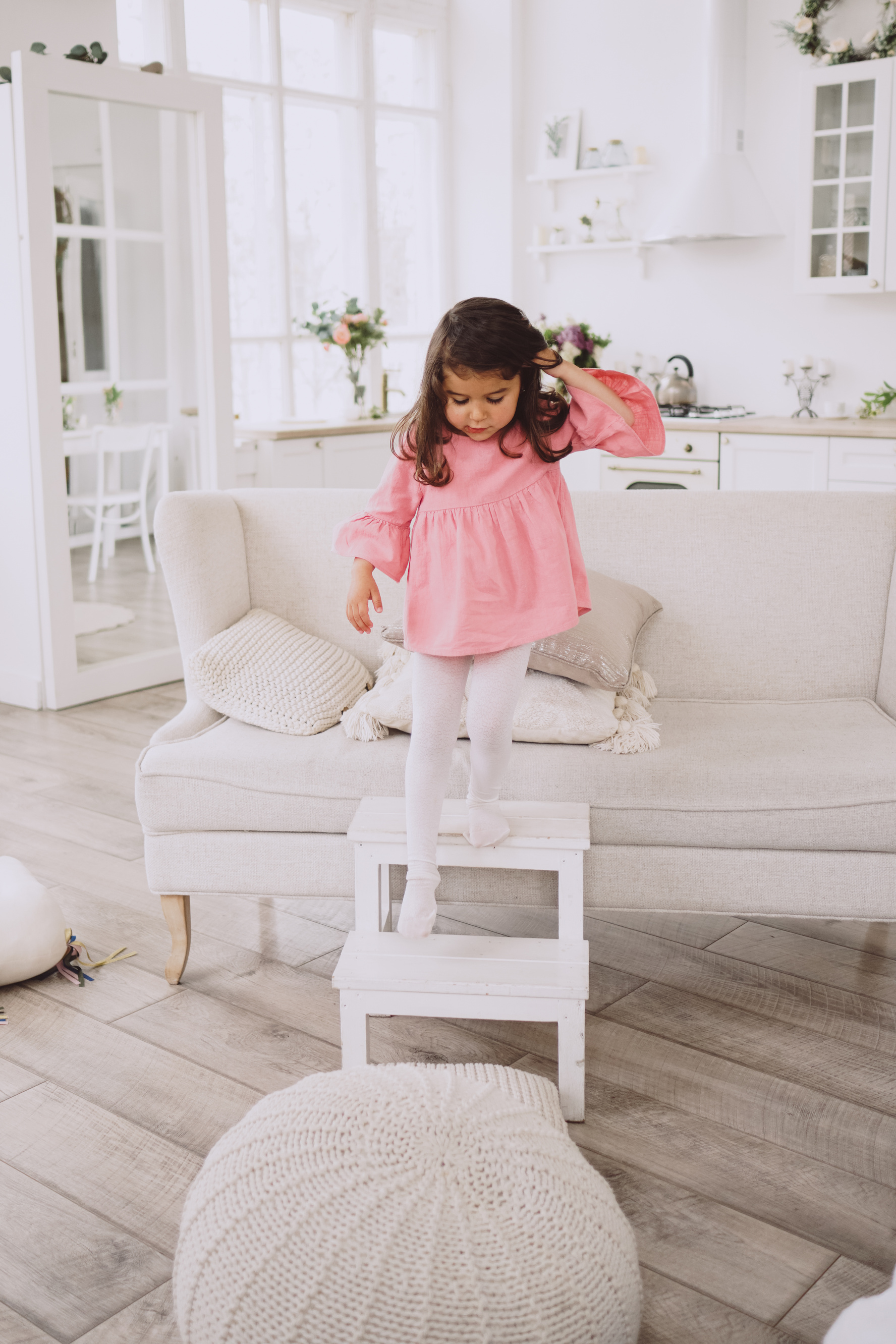 Little Girl Playing with Step in the Living Room